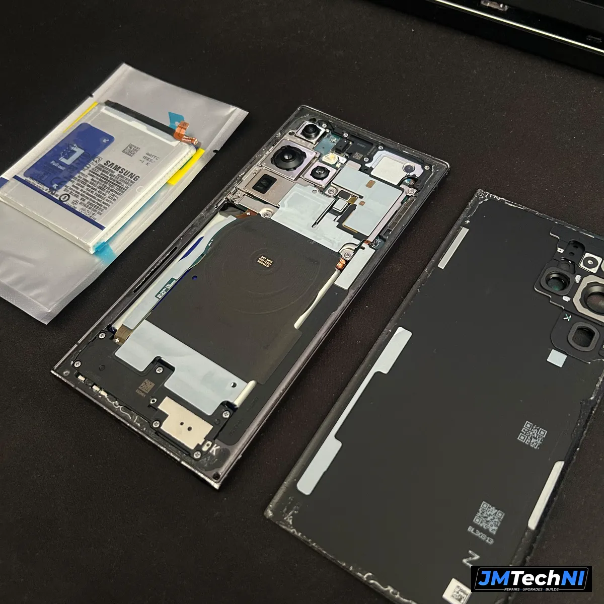 Back glass off with the new battery ready to fit